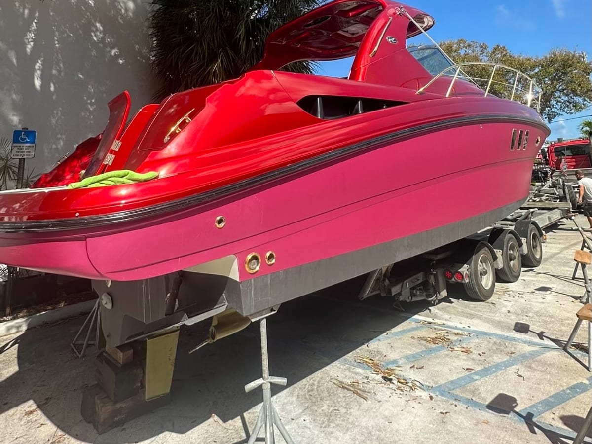 Sport boat wrapped in bright pink and red